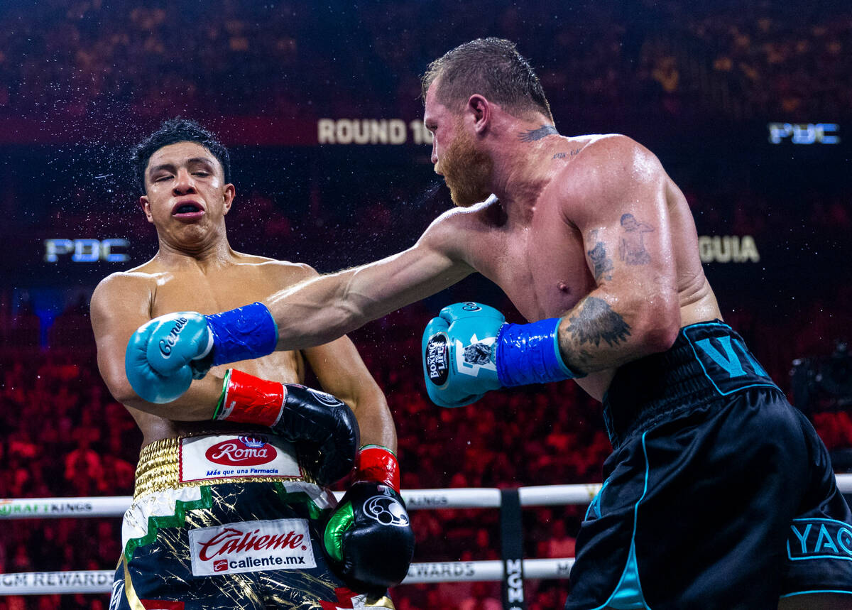 Jaime Munguia takes a shot to the chin from Canelo Alvarez during the tenth round of their PPV ...