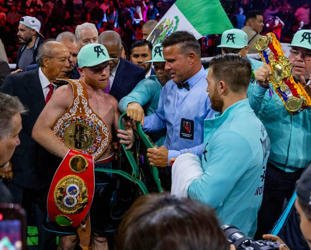 Canelo Alvarez with his belts after defeating Jaime Munguia during their PPV boxing night fight ...
