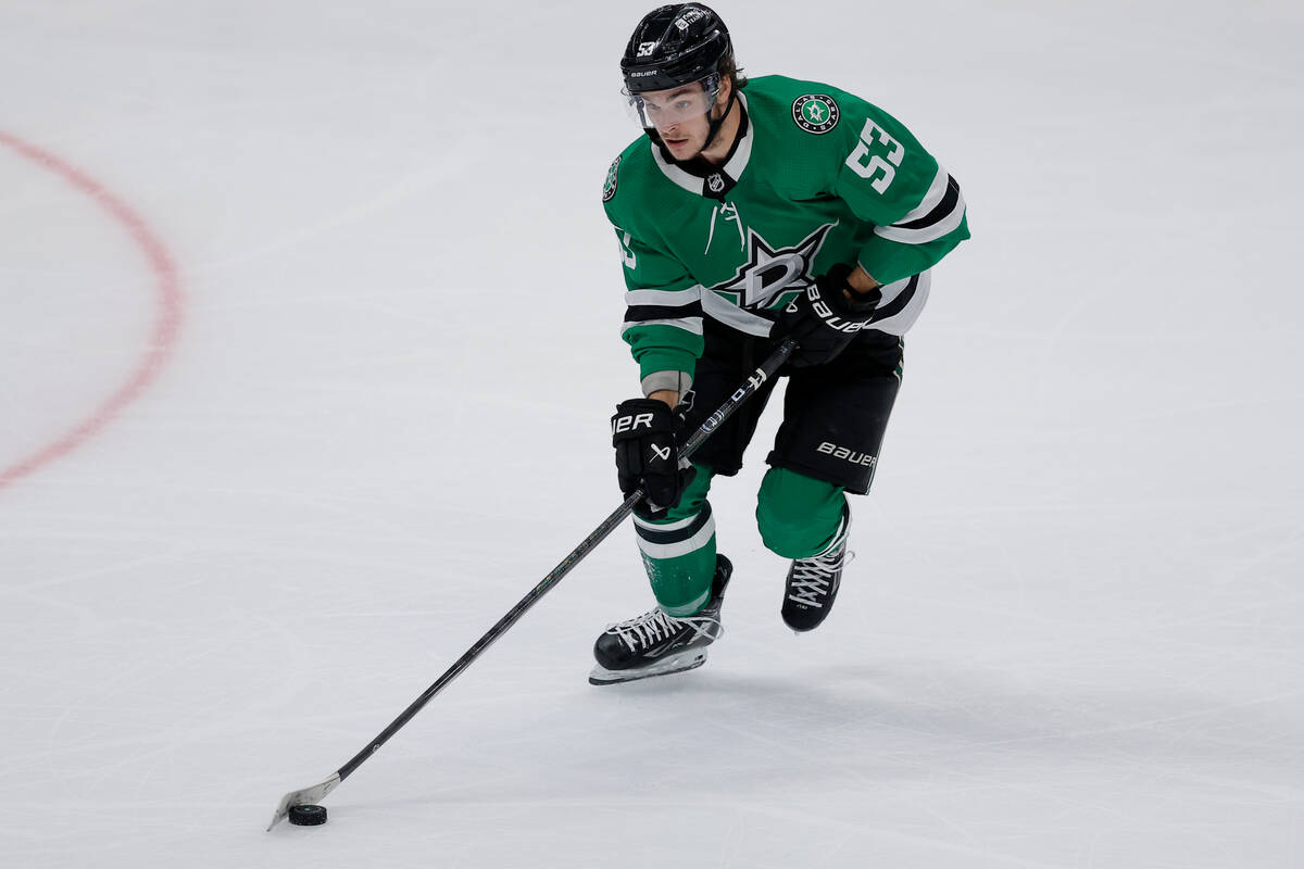 Dallas Stars center Wyatt Johnston skates with the puck against the Vegas Golden Knights during ...