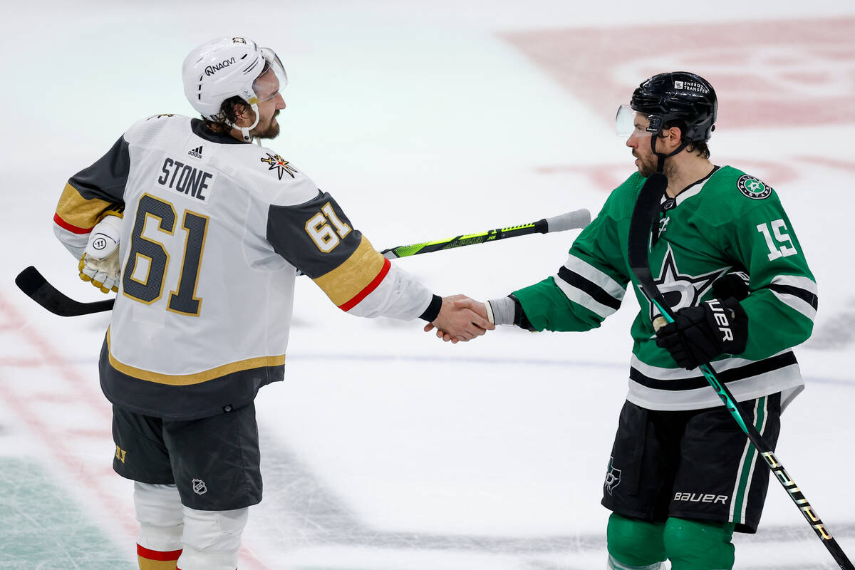 Vegas Golden Knights right wing Mark Stone shakes hands with Dallas Stars center Craig Smith (1 ...
