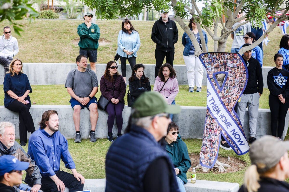 Participants listen during a rally hosted by the Las Vegas chapter of the Israeli-American Coun ...