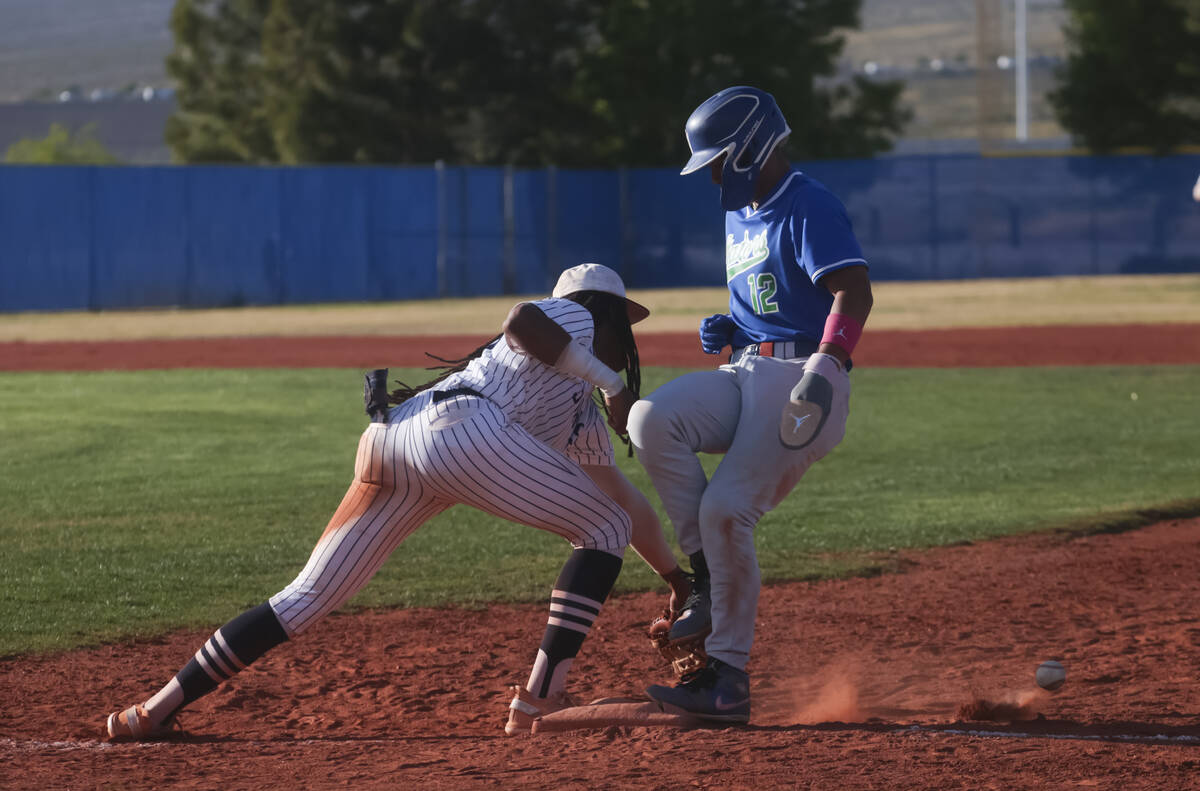 Shadow Ridge's Christian Wilkes (30) misses the pass to try and tag out Green Valley's Caden Ki ...