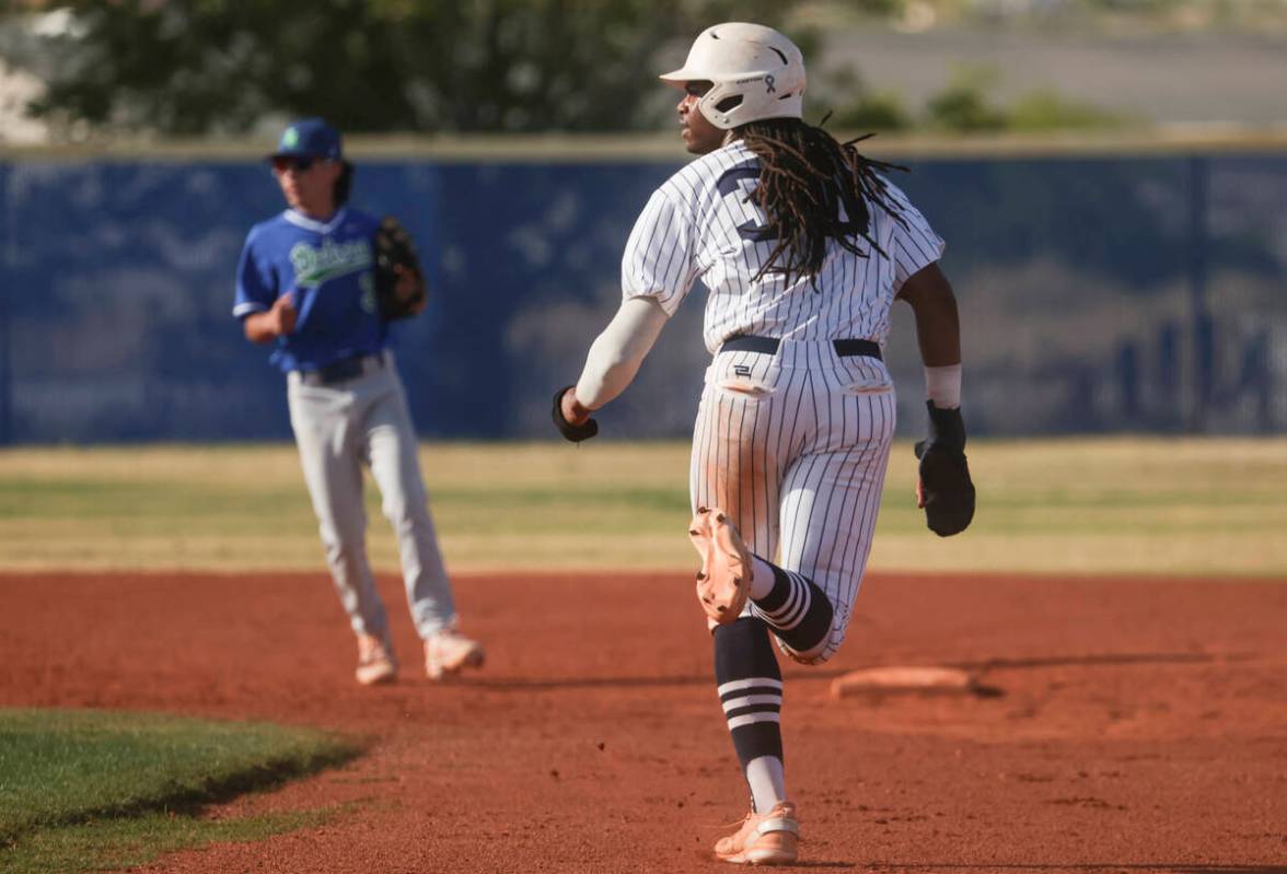 Shadow Ridge's Christian Wilkes (30) runs to second base against Green Valley during a high sch ...