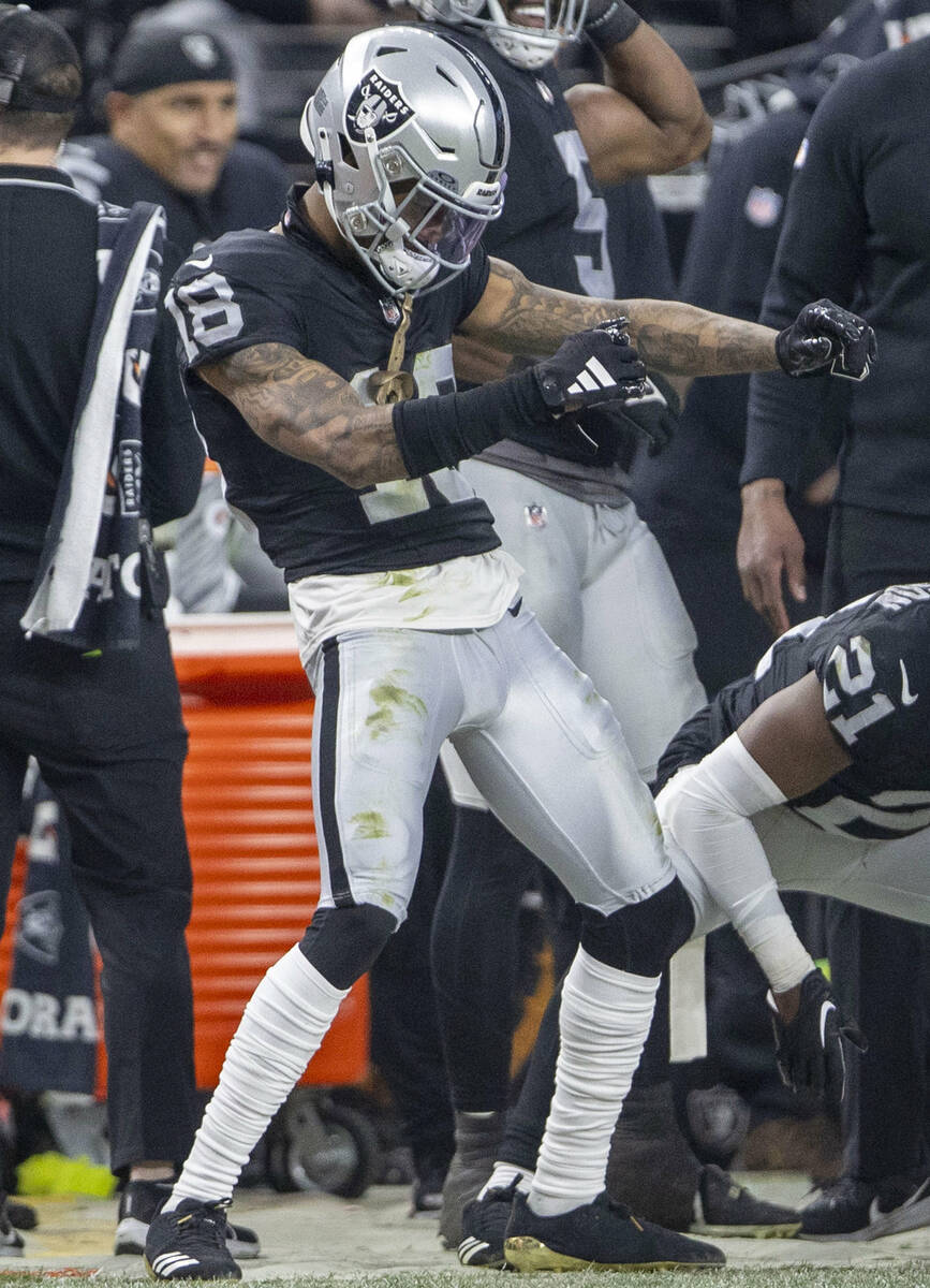 Raiders cornerback Jack Jones (18) dances on the sideline during the second half of an NFL game ...
