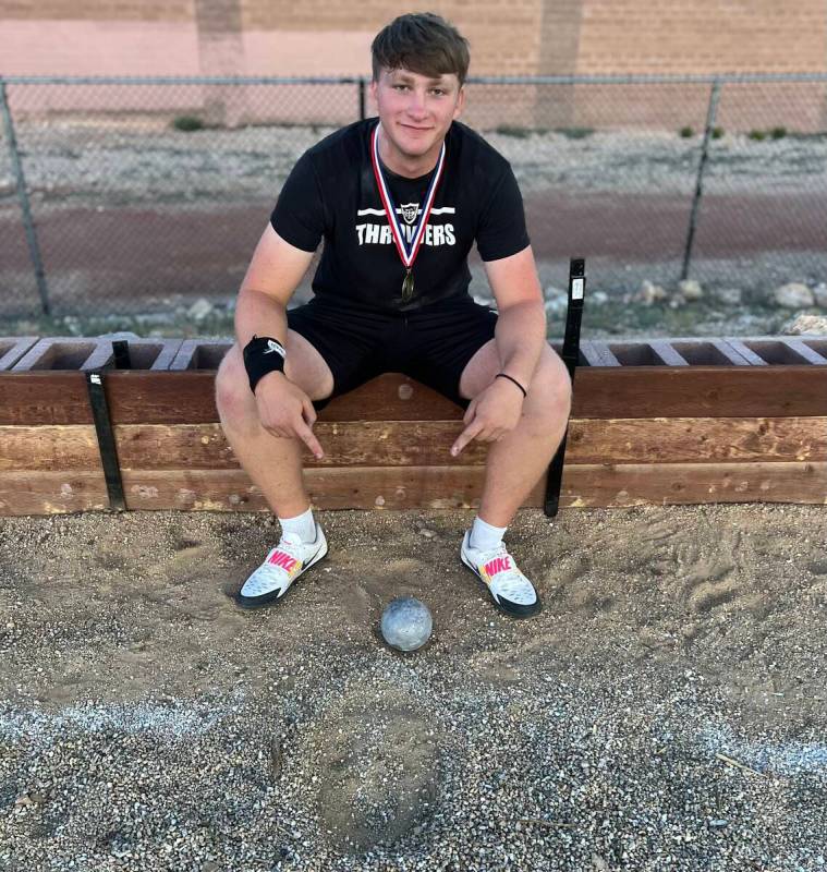 Faith Lutheran senior Preston Beery points to the spot where his state record throw in the shot ...