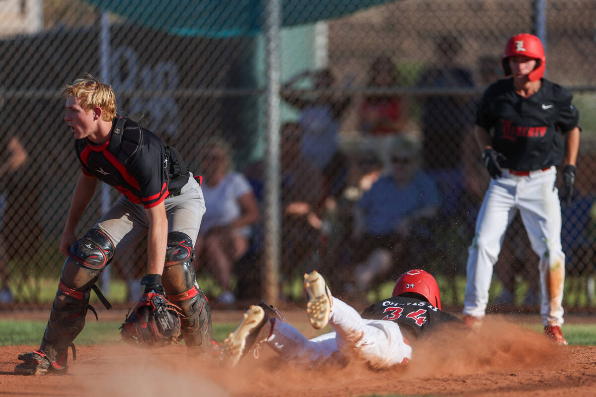 Liberty outfielder Rashaan Chavis (34) slides safely into home plate for the game-winning run w ...