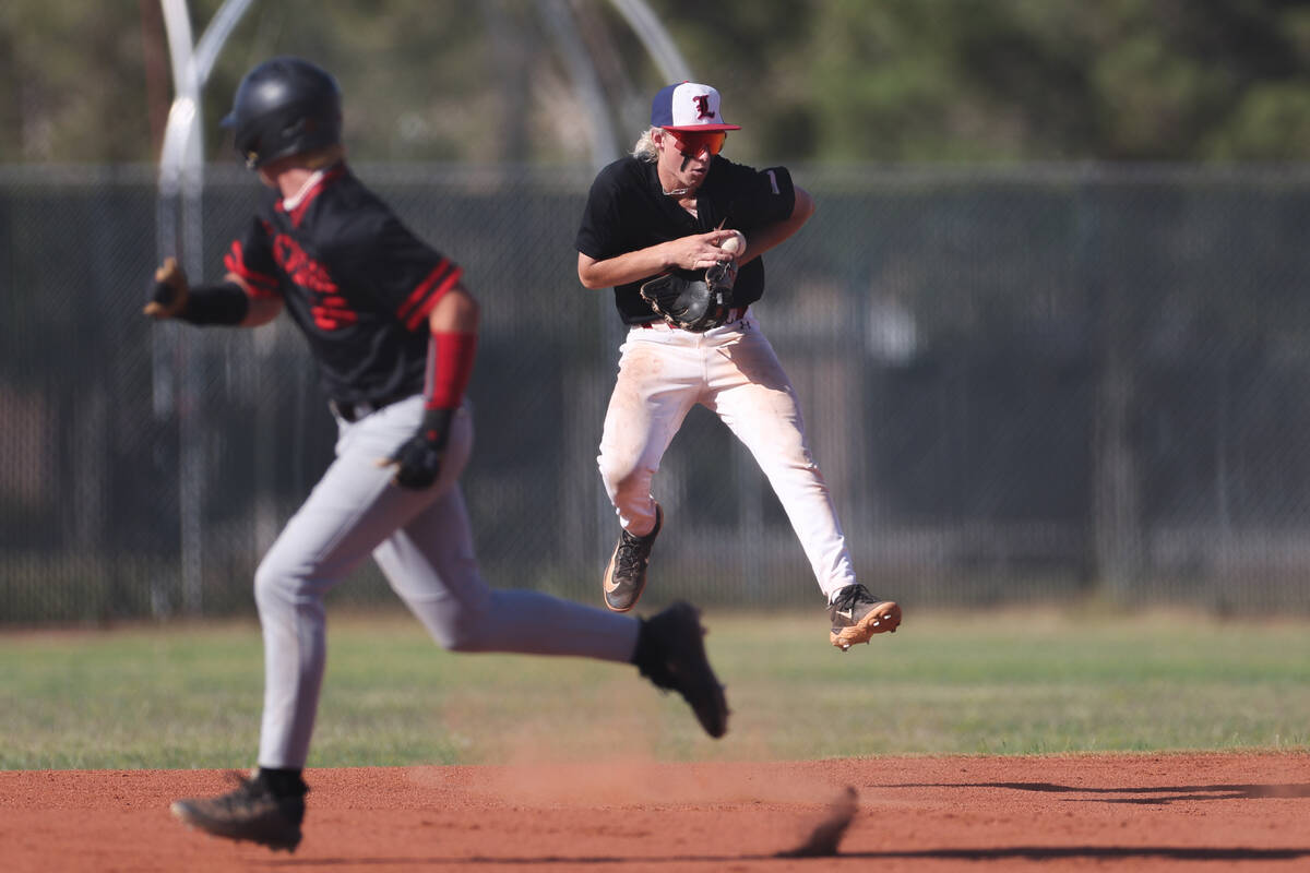 Liberty’s Konner Brown catches before ending the inning at first base while Las Vegas' D ...
