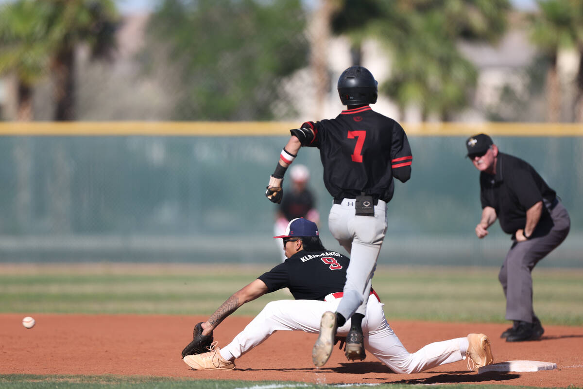 Liberty's Jaydrien Klein-Baker (9) lunges before catching to out Liberty's Konner Brown (7) dur ...