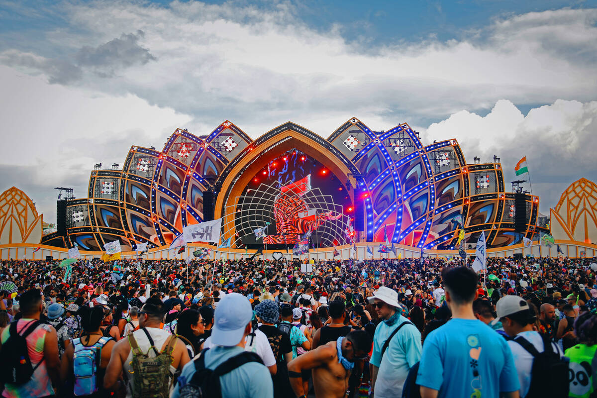 Festival attendees listen to a set at the cosmicMEADOW stage during the first day of Electric D ...