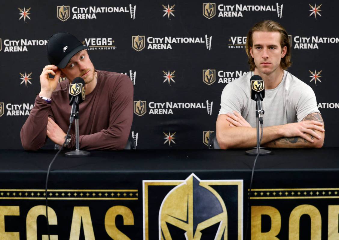 Golden Knights center Jack Eichel, left, and defenseman Noah Hanifin listen to reporters questi ...