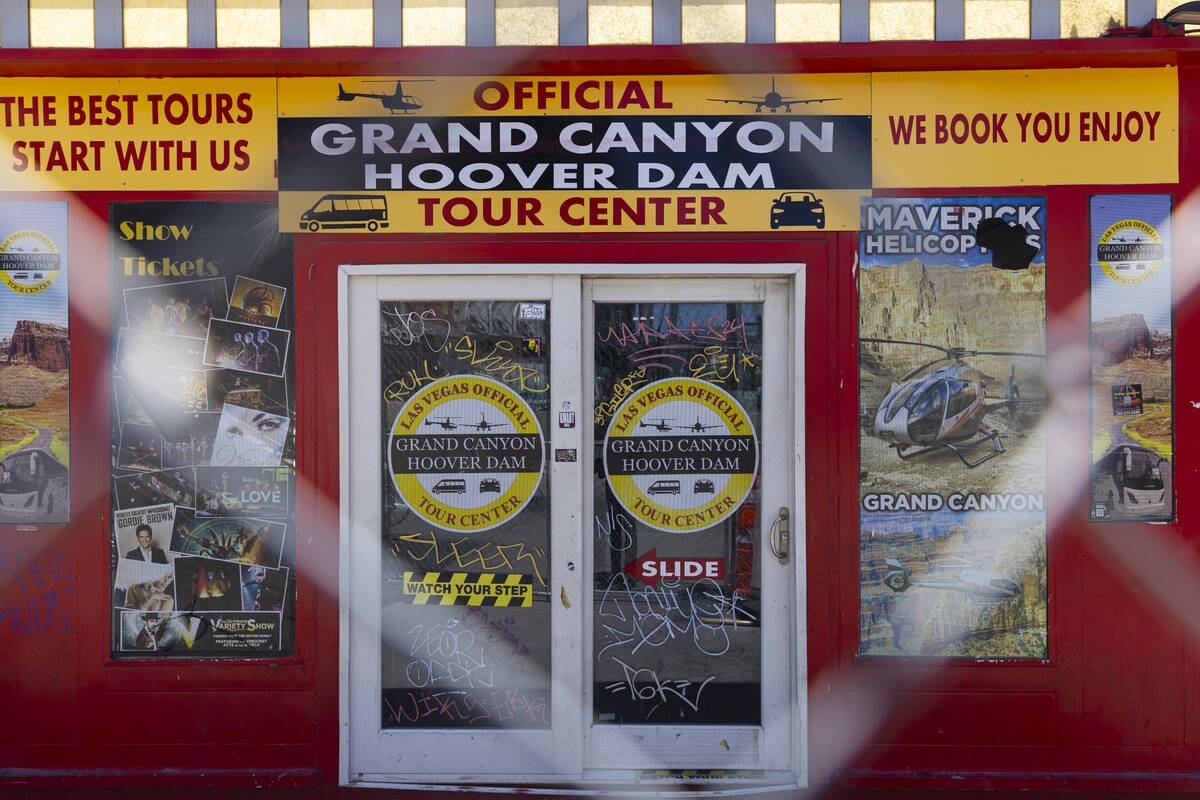 A shuttered tour center building sits with graffiti at the site of a planned casino-resort, own ...