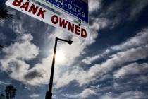 A realtor sign gives notice that a home for sale in the Summerlin area is "Bank Owned" Wednesda ...