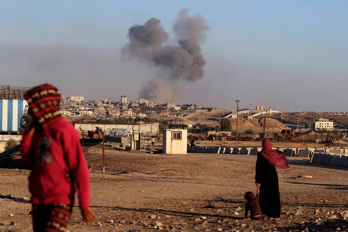 Smoke rises following an Israeli airstrike on buildings near the separating wall between Egypt ...