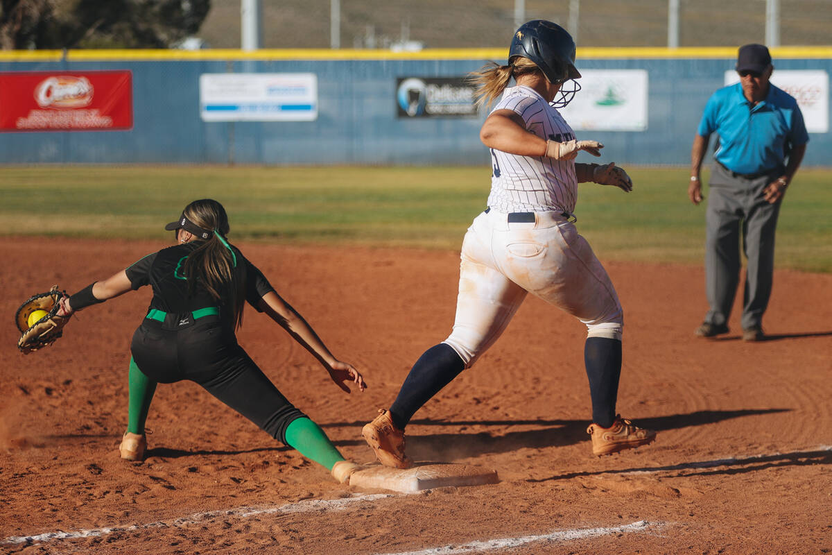 Shadow Ridge’s Jacobi Gledhill (13) runs to first base as Palo Verde’s Hayley Kea ...