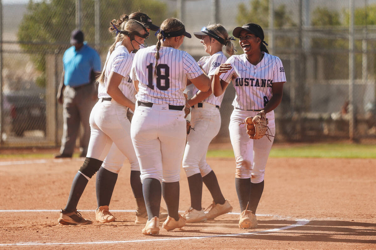 Shadow Ridge players celebrate after an inning during a Class 5A Southern Region high school so ...