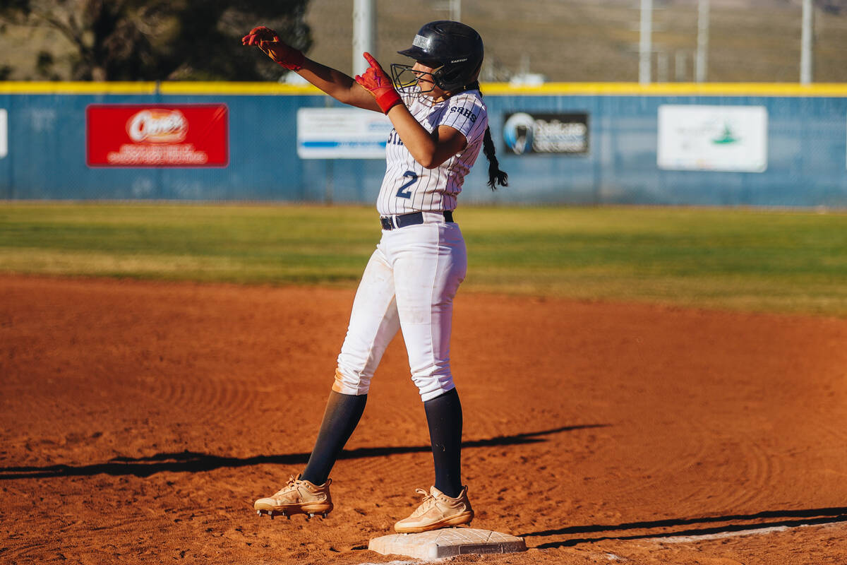 Shadow Ridge’s Carmella Garganese (2) signals to her teammates after making it to first ...