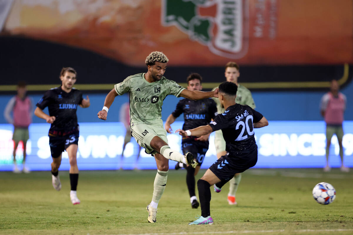 Los Angeles FC midfielder Timothy Tillman (11) kicks the ball past Las Vegas Lights FC defender ...