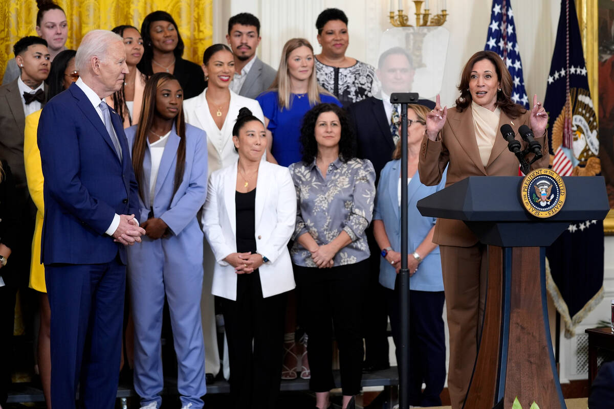 Vice President Kamala Harris speaks as President Joe Biden, left, listens during an event to ce ...