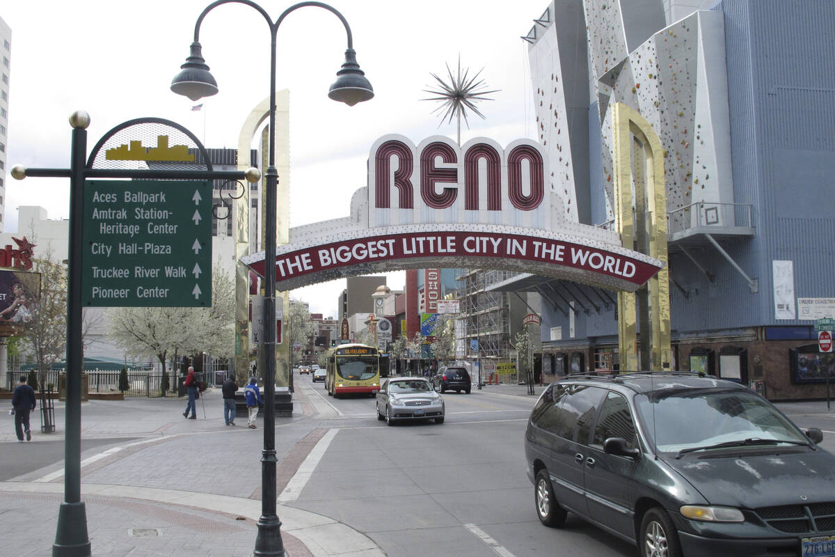 Pedestrians and traffic on Virginia Street on Thursday, March 27, 2014, in downtown Reno. Leade ...