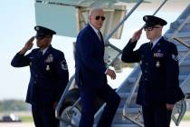 President Joe Biden boards Air Force One as he departs Milwaukee Mitchell International Airport ...
