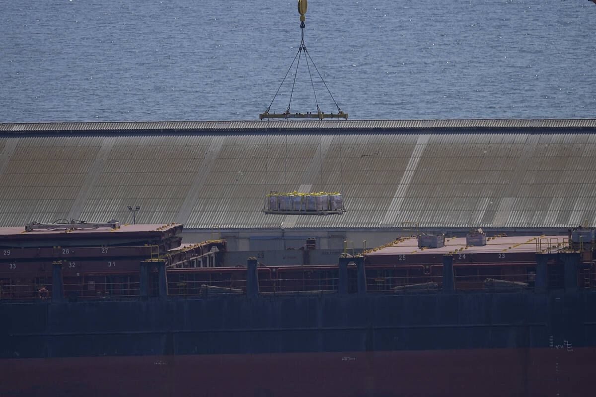 A crane loads food aid for Gaza onto the container ship Sagamore docked at Larnaca port, Cyprus ...