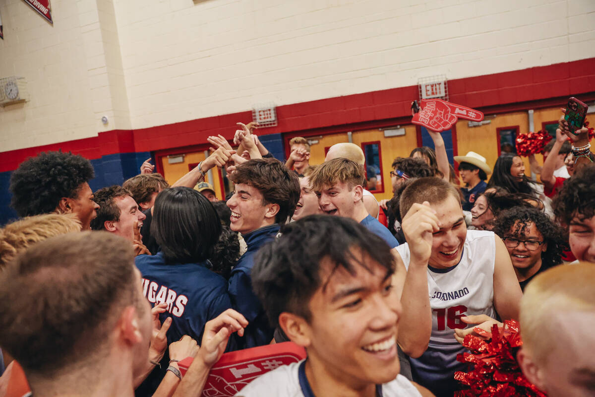 Coronado players and students from the student section celebrate Coronado winning during a Clas ...