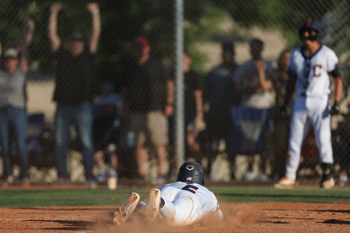 Coronado third baseman Louis Dion (6) slides into home to score the game-winning run during a C ...