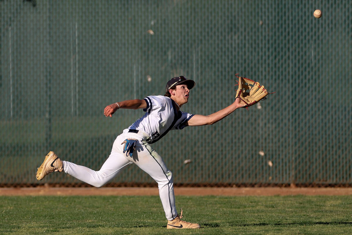 Coronado outfielder Drew Steffen (13) dives to catch for an out during a Class 5A high school b ...