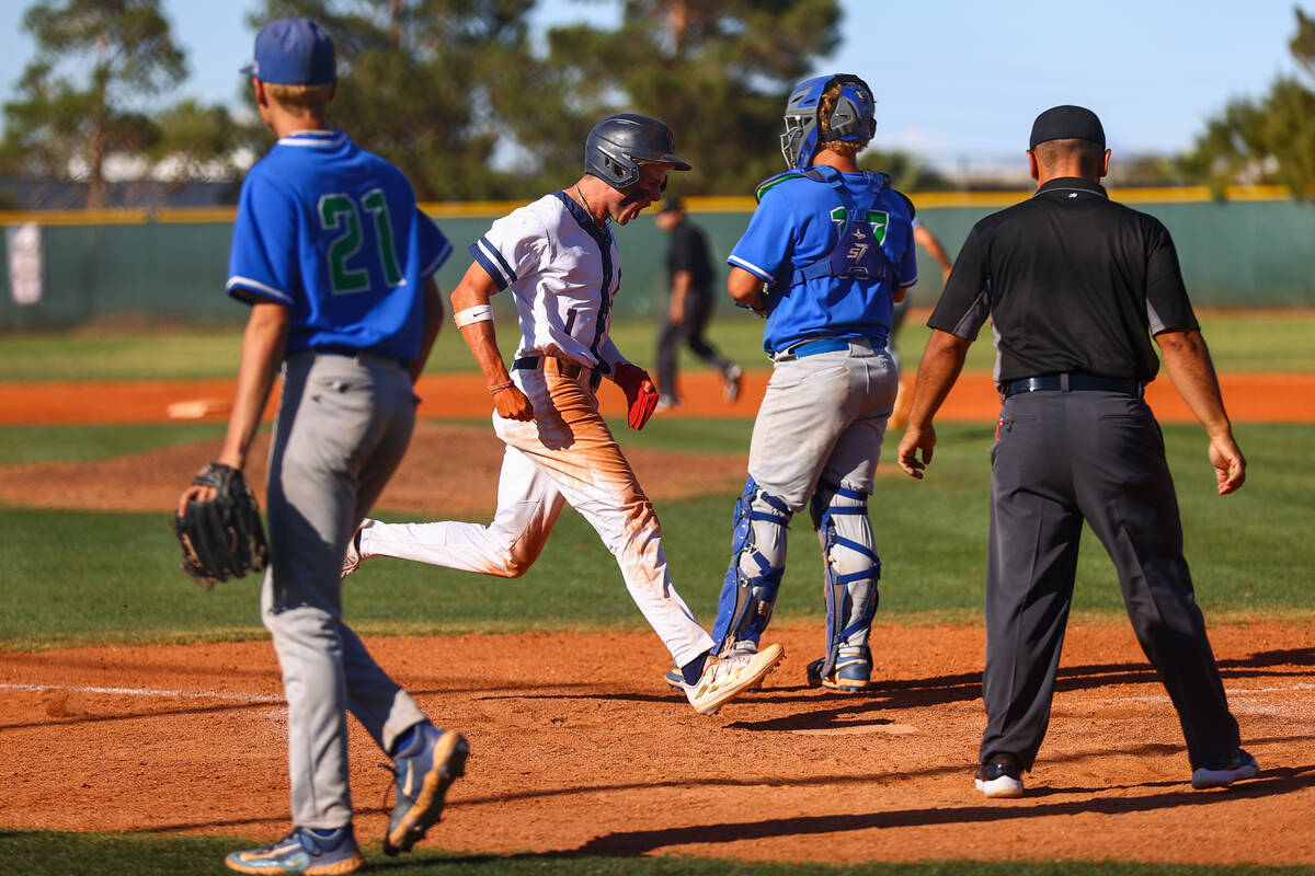 Coronado pitcher Evan Festa (1) celebrates as he reaches home plate while Green Valley looks ou ...