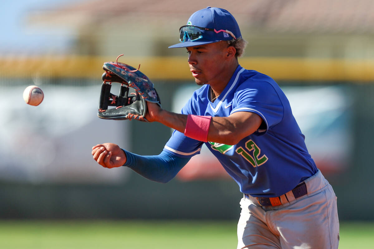 Green Valley infielder Caden Kirby (12) catches for an out on Coronado during a Class 5A high s ...