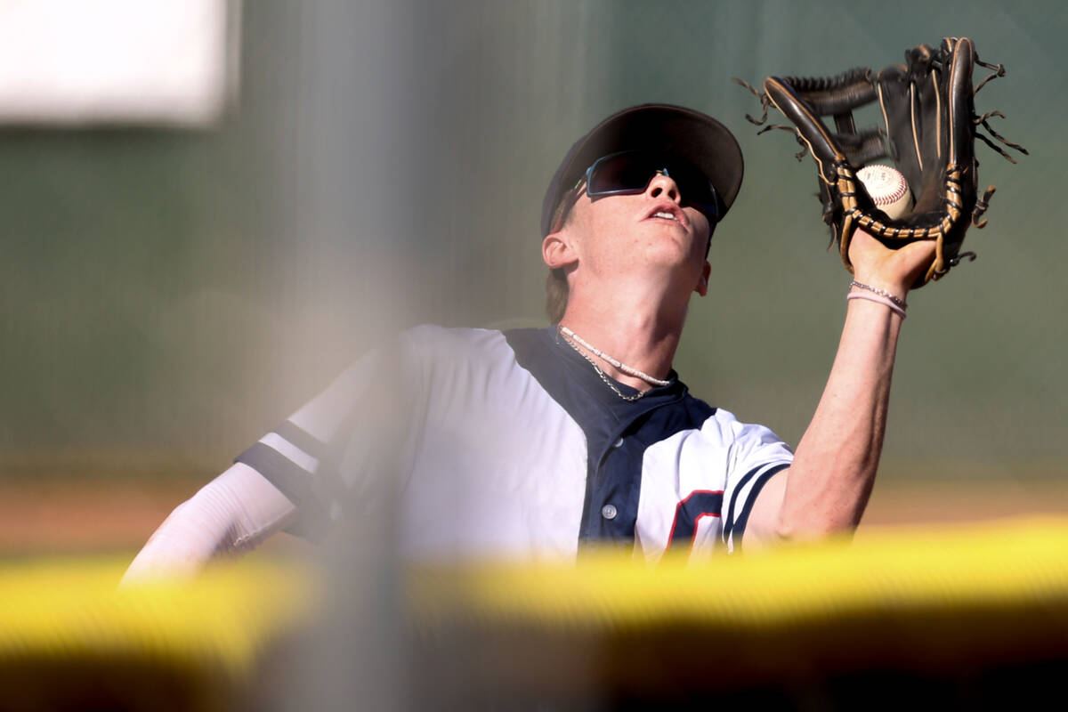 Coronado outfielder Vinny Kistle catches a foul ball for an out on Green Valley during a Class ...