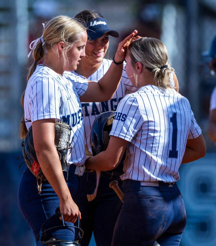 Shadow Ridge pitcher Josslin Law (4) keeps Stevie Robison (1) focused on batting against Corona ...