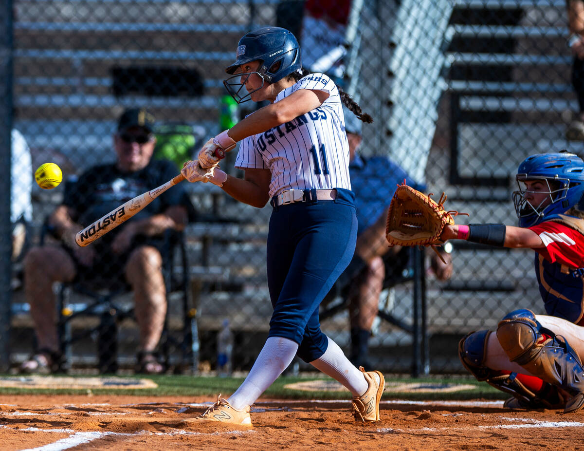 Shadow Ridge batter Alina Pavlovich (11) connects on a pitch against Coronado during the second ...