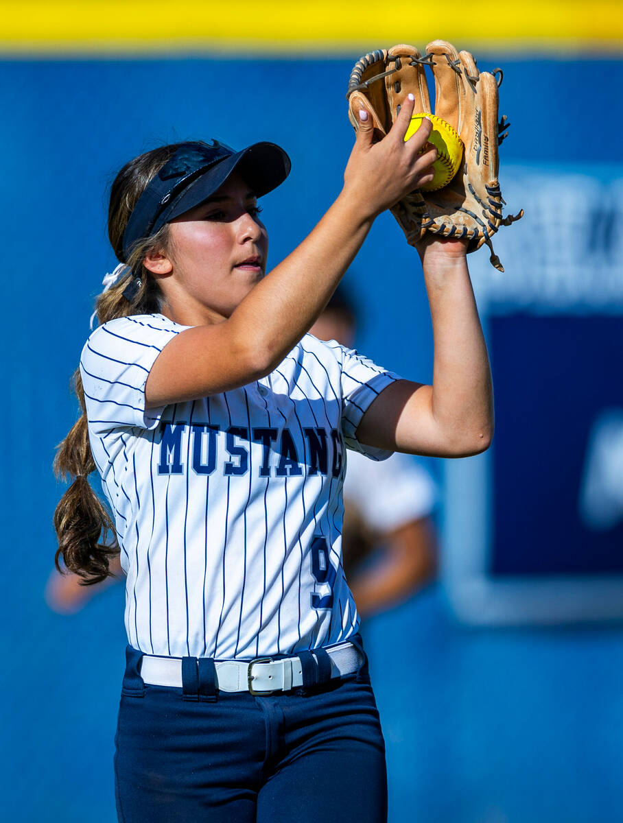 Shadow Ridge outfielder Giselle Castellanos (9) secures a fly ball for an out against Coronado ...