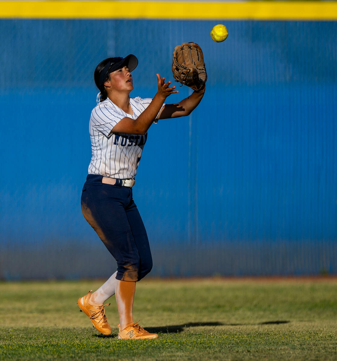 Shadow Ridge outfielder Alina Pavlovich (11) grabs a fly ball for an out against Coronado durin ...