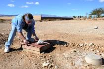 Howard Johnson checks the irrigation system he installed at his unfinished subdivision in the s ...