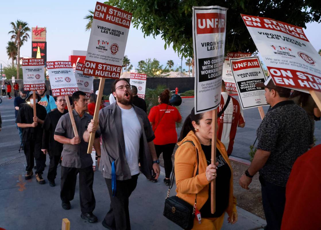 Culinary Local 226 members walk the picket line at the start of a 48 hour strike at Virgin Hote ...