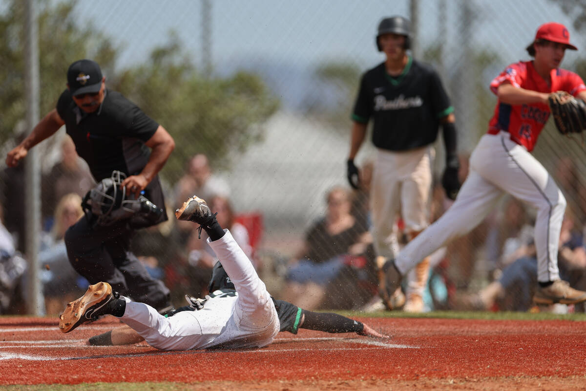 Palo Verde’s Karsen Smaka slides into home plate to score on Coronado during a Class 5A ...