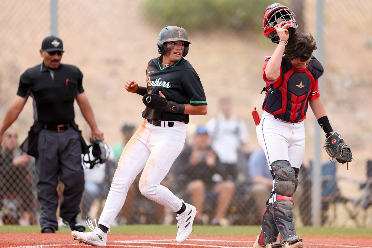 Palo Verde’s Luke Herrera scores at home plate while Coronado catcher AJ Salteri reacts ...