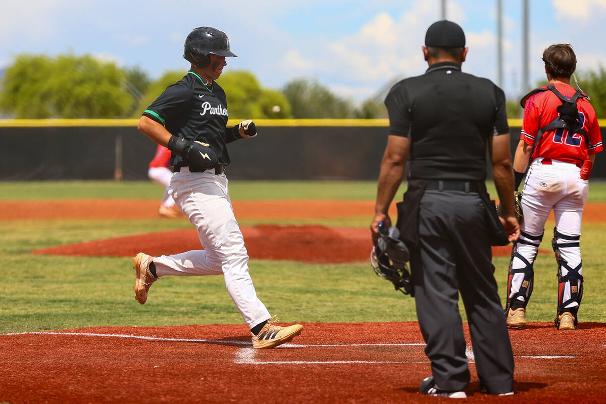 Palo Verde’s Tanner Johns arrives safely to home plate while Coronado catcher AJ Salteri ...