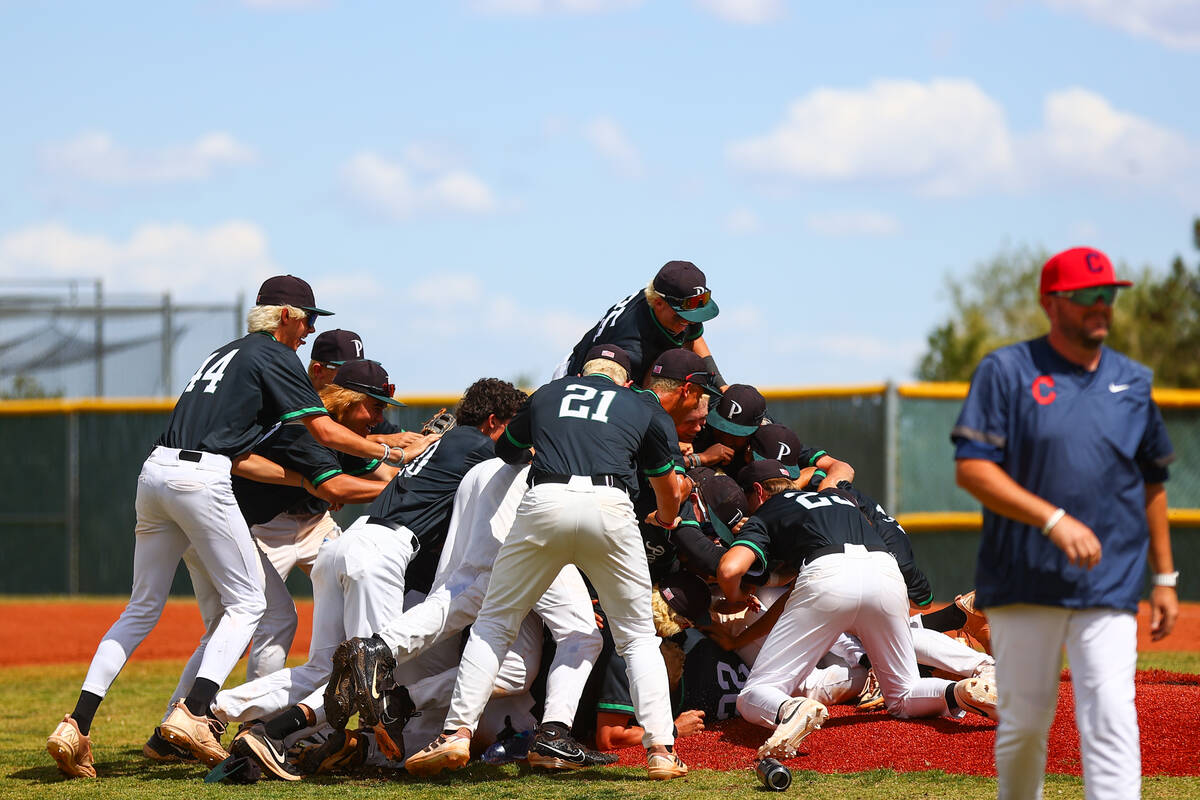 Coronado dog piles their pitcher after winning a Class 5A high school baseball Southern Region ...