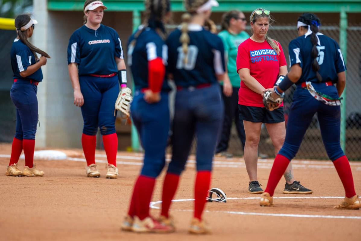 Coronado head coach Lauren Taylor looks to her pitcher Sarah Lopez after she took a hit ball to ...