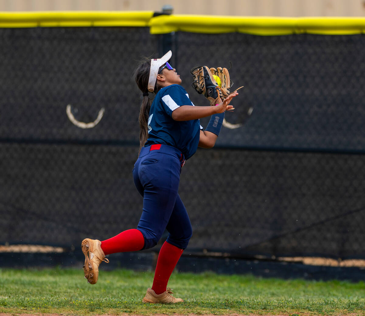 Coronado outfielder Summer Gilliam (3) runs down a fly ball from a Palo Verde batter during the ...