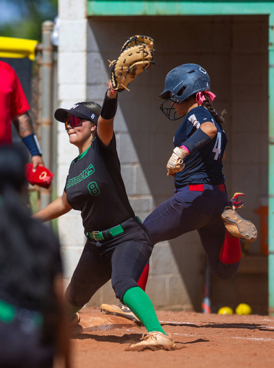 Palo Verde infielder Haley Kearnes (8) catches an out a first base beating a tag by Coronado ru ...