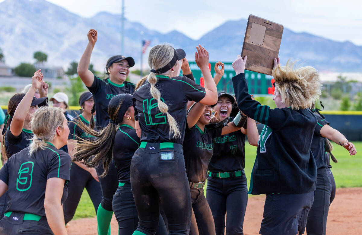 Palo Verde teammates celebrate receiving the winning plaque after defeating Coronado in their 5 ...