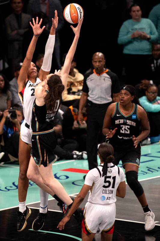 Las Vegas Aces forward A'ja Wilson (22) denies a shot by New York Liberty forward Breanna Stewa ...