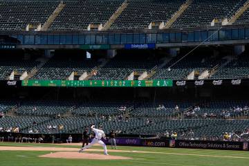 Oakland Athletics pitcher Ross Stripling, bottom, works against the Pittsburgh Pirates during t ...