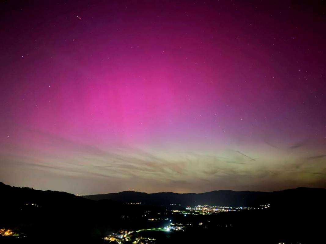 Northern lights appear over the Dreisamtal valley in the Black Forest near Freiburg, Germany, F ...