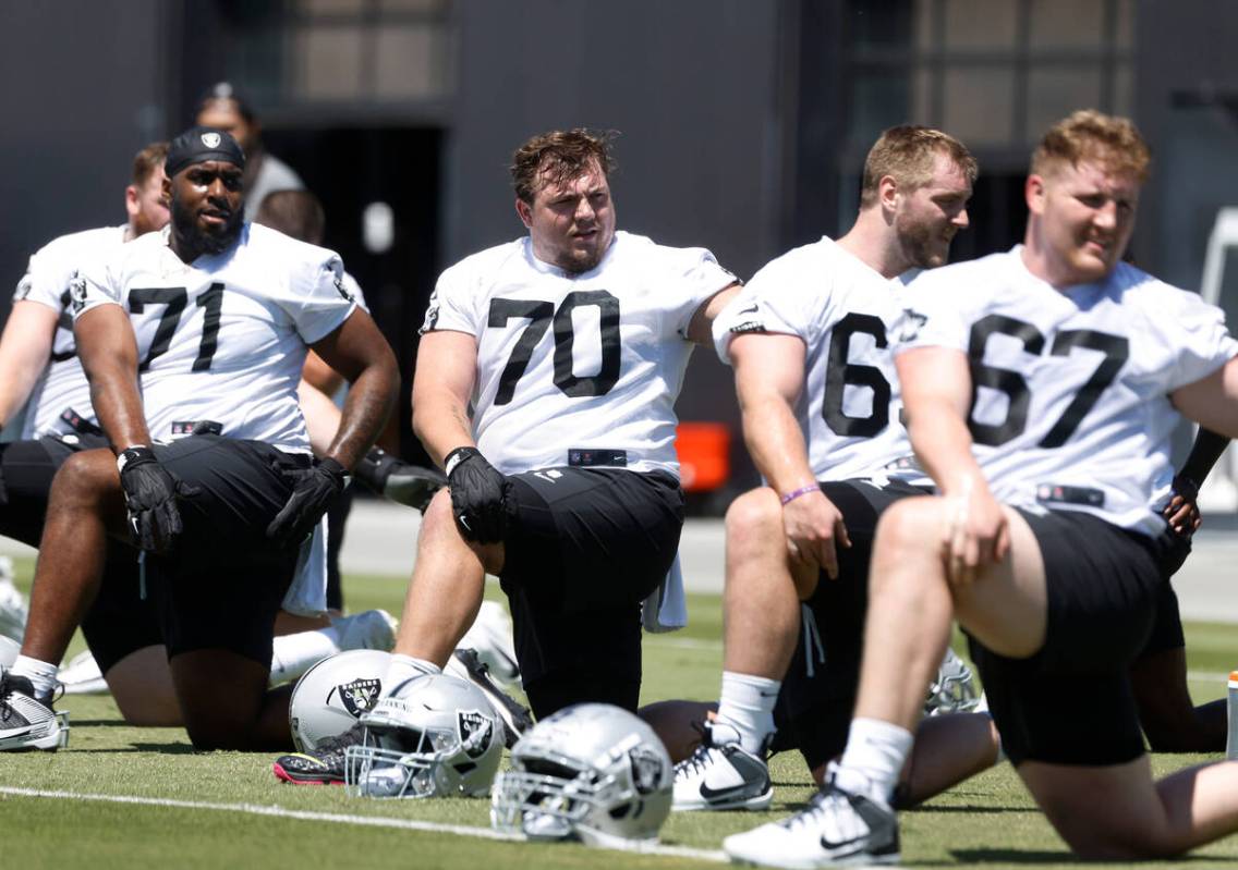 Raiders rookies guard Jackson Powers-Johnson (70) defensive tackle DJ Glaze (71) guard Jake Joh ...