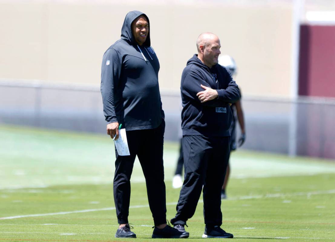 Raiders head coach Antonio Pierce, left, and special teams coordinator Tom McMahon watch their ...